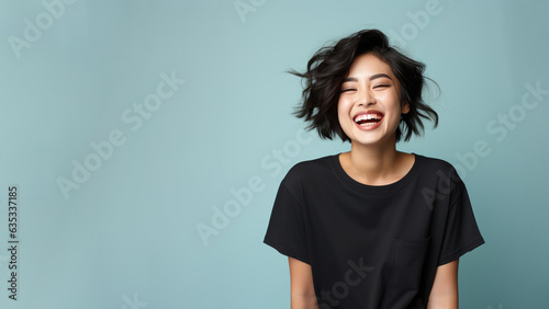 Cheerful asian positive girl wearing activewear, laughing out loud