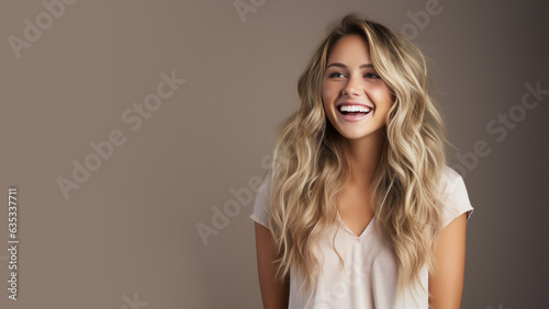 Blonde happy girl is laughing out loud isolated on pastel background with copy space