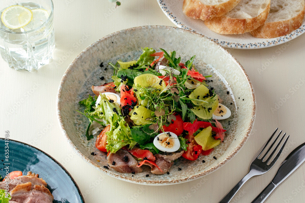 nicoise salad with tuna and quail eggs . restaurant menu nicoise salad with tuna and quail eggs . restaurant menu