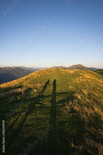 The shadows of two hikers in the Pyrenees photo