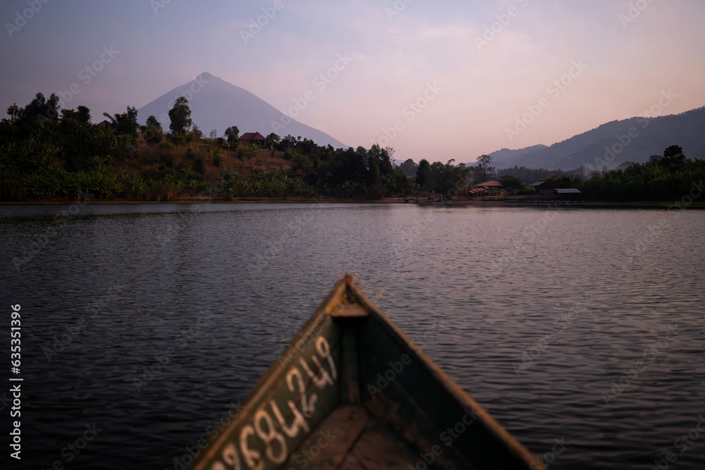 Sunrise over lake with volcano in the background in Ruanda, Africa