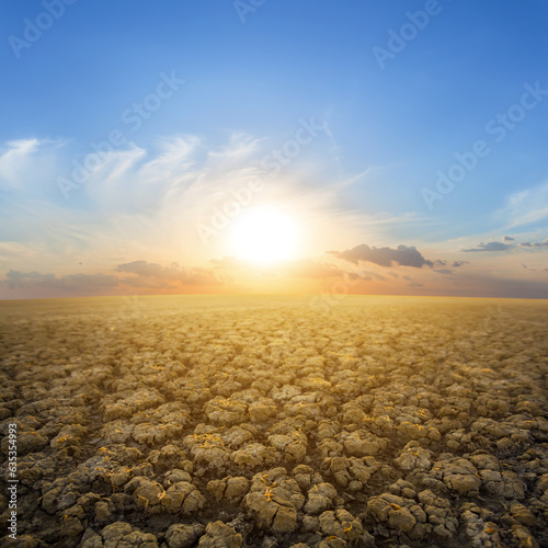 dry cracked earth at the sunset, natural water calamity scene