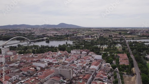 Aerial view of city Merida in Spain, Lusitania Bridge and mountains in background photo