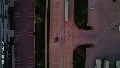 Top down aerial at sunset while dry van-reefer semi truck driver is driving. Ilinois, America, Downers Grove in the evening photo