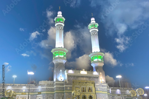 The Kaaba and its minarets were photographed in long exposure with the zamzam tower. photo