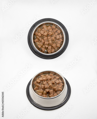 Pet bowls with feed on white background. Wet feed. Collage. Pet bowls with feed.