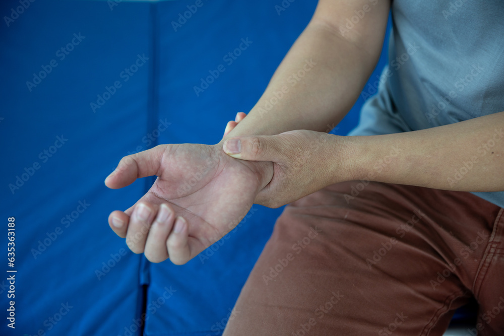 Close-up photo of a man with wrist pain health care concept Close-up photo of a man with wrist pain health care concept