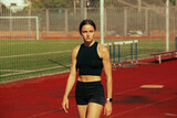 Athlete training on running track.
