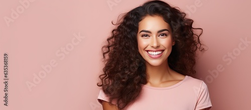Confident and satisfied Hispanic woman smiling happily with a concept on copy space