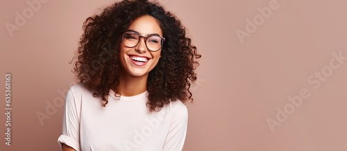 Confident and satisfied Hispanic woman smiling happily with a concept on copy space