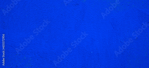 Dark blue concrete wall surface. Old cement background. Copy space for design.	