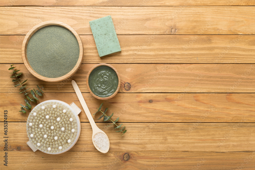 Composition with cosmetic clay and spa products on wooden background, top view Composition with cosmetic clay and spa products on wooden background, top view