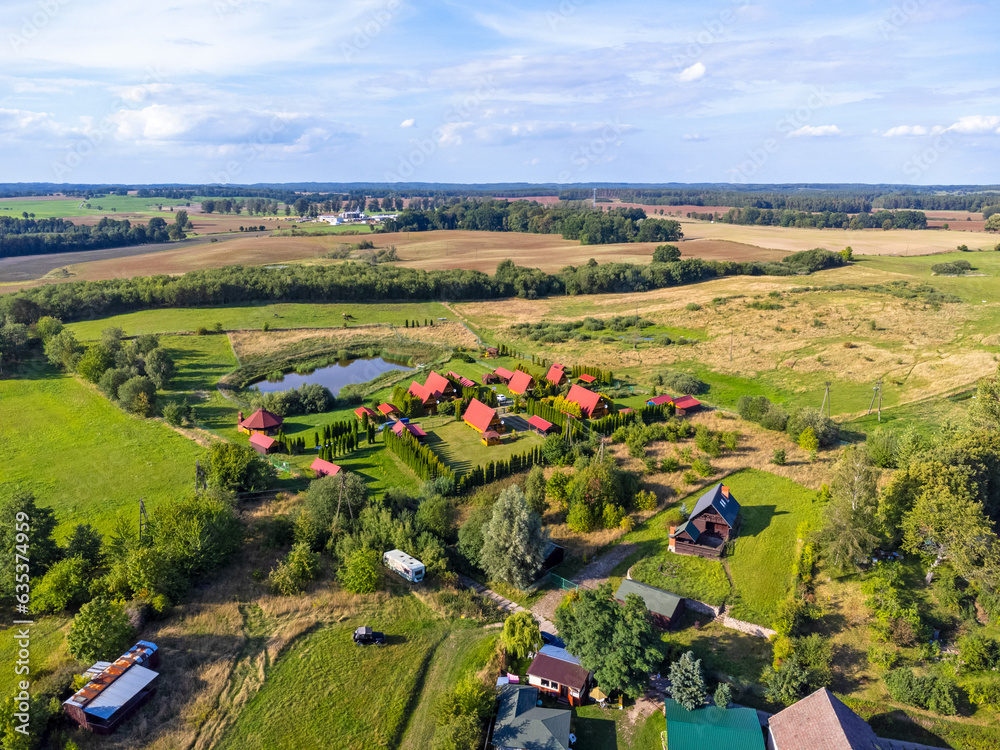 Aerial view landscape, view of small lake , forests, park, small village with houses.