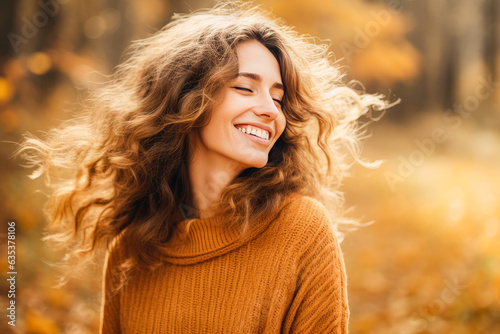 Leinwand Poster Beautiful young woman portrait smiling in autumn park outdoors