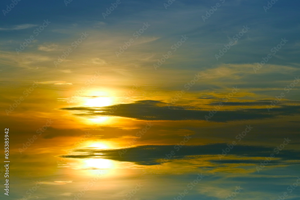 reflection sunset colorful dark blue orange sky and dark yellow cloud and sun lower left flame