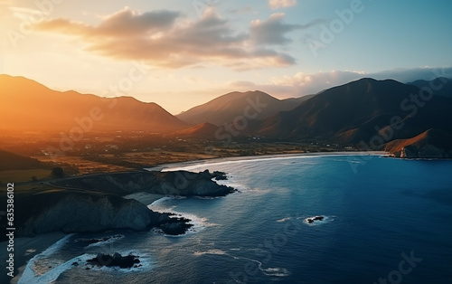 Aerial beautiful shot of a seashore with hills on the background at sunset