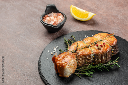 delicious salmon steak with spices and herbs on a dark background, banner, menu, recipe place for text, top view