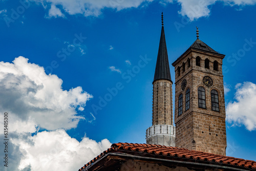 The Ottoman Era Clock Tower and  the minaret in the old town of Sarajevo
