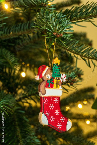 Small stocking ornament on a christmas tree