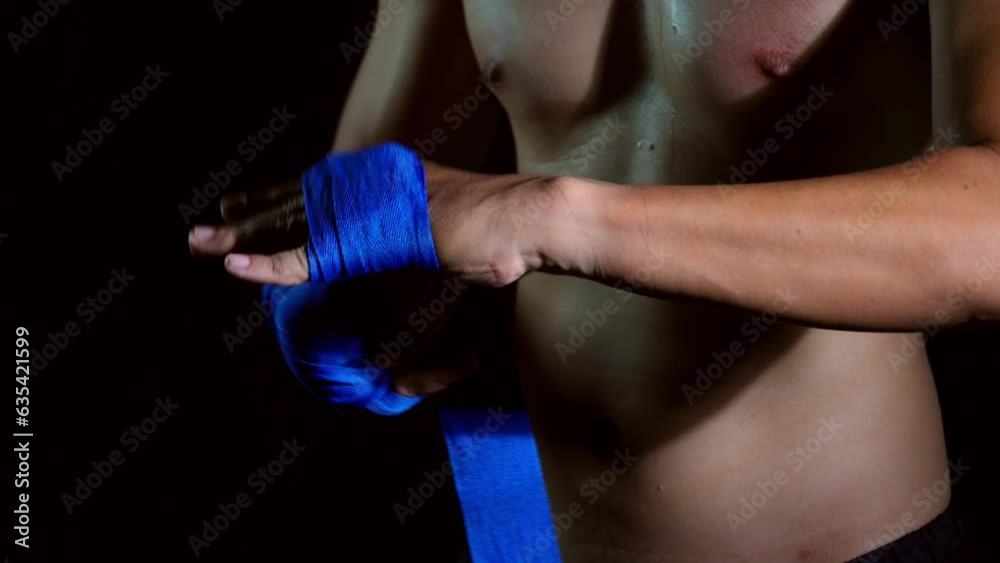 In the gym, fighters train hard and practice their punches. They wrap their hands with bandages before boxing to protect them. In the gym, fighters train hard and practice their punches. They wrap their hands with bandages before boxing to protect them.