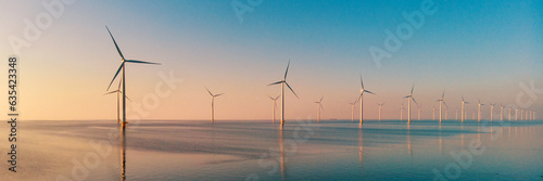 Wallpaper Mural Windmill park with clouds and a blue sky, windmill park in the ocean aerial view with wind turbine Flevoland Netherlands Ijsselmeer. Green Energy production in the Netherlands on a sunny day Torontodigital.ca