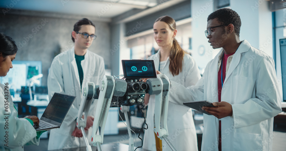 Diverse Team of Industrial Robotics Specialists Gathered Around a Table With Mobile Robot. Engineers In Lab Coats Discussing an Automated AI Robotic Dog, Using Laptop and Tablet and Brainstorming. Diverse Team of Industrial Robotics Specialists Gathered Around a Table With Mobile Robot. Engineers In Lab Coats Discussing an Automated AI Robotic Dog, Using Laptop and Tablet and Brainstorming.