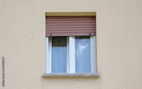 Residential house protected by a metal shutter