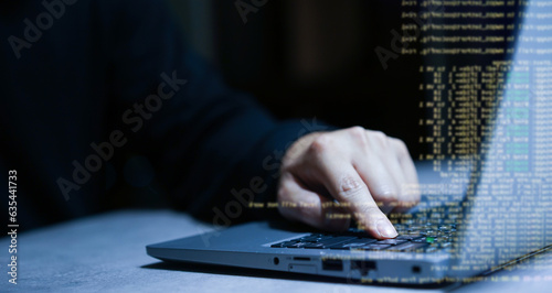 close up hacker man hand press on enter button to try to access security password of company and run software programming to download data and information from system for hacking technology concept photo