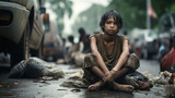A homeless child sits and asks for food, the problem of hunger, drought, poverty