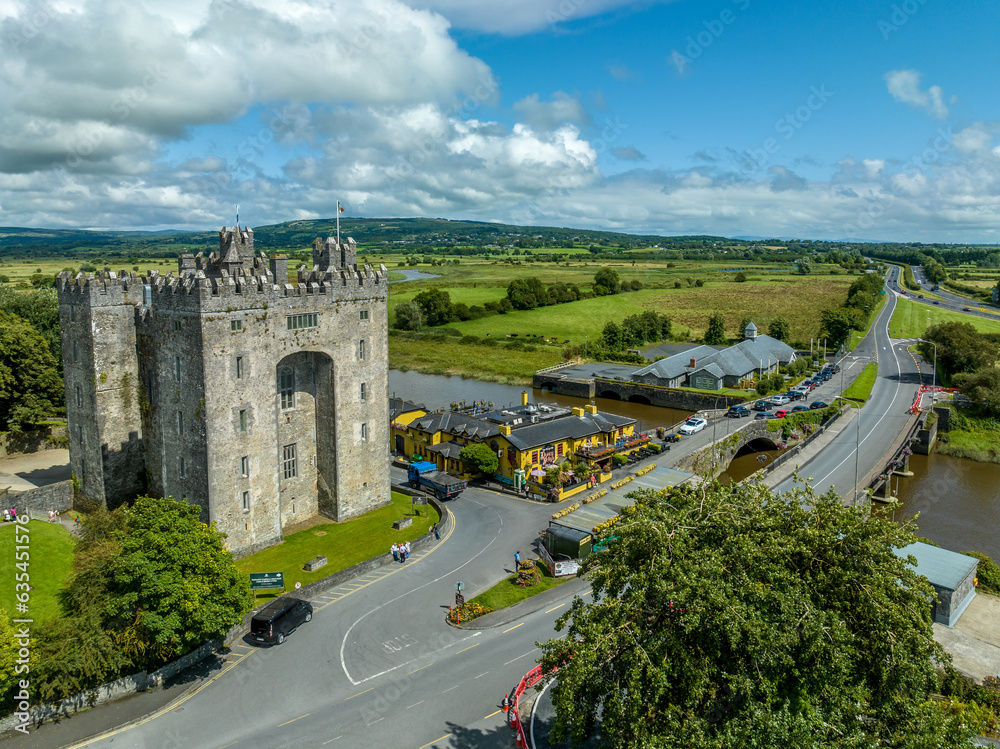 Aerial view of Bunratty Castle  large 15th-century tower house in County Clare in Ireland guarding the crossing on the Ralty river before it reaches the Shannon estuary