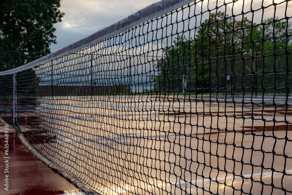 Wet net on a new combined tennis pickleball court Wet net on a new combined tennis pickleball court