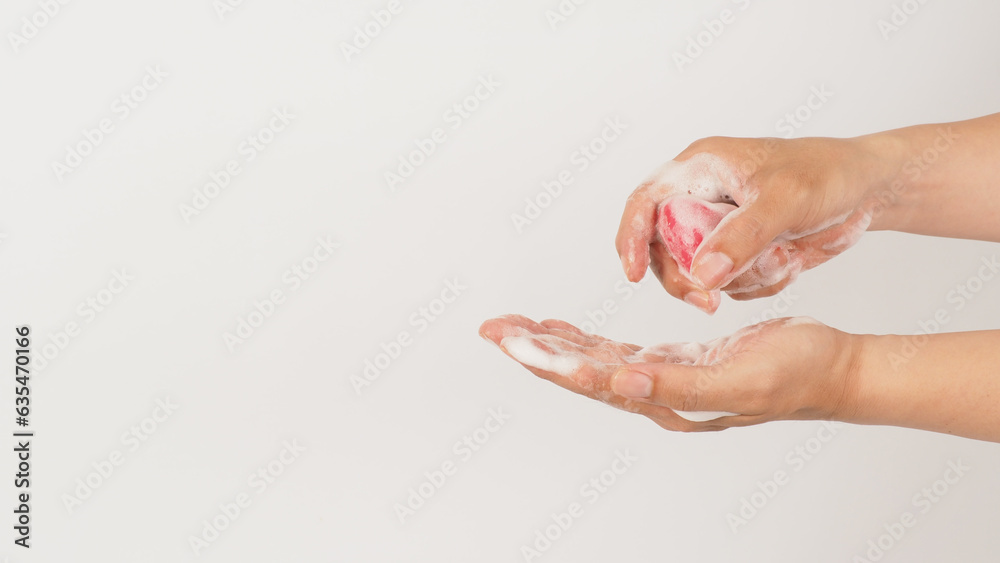 Hands washing with foaming and pink soap on white background. Hands washing with foaming and pink soap on white background.