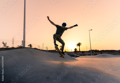 young man skates in a skate park at sunset y Gran Canaria. Canary Islands