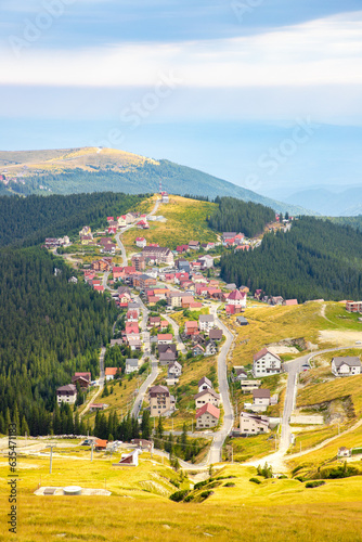 Landscape with the Ranca resort in Romania seen from the Transalpina road in summer photo