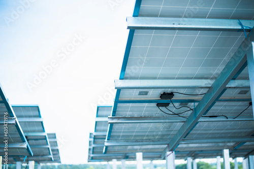 Solar cell connector. Solar PV connector of the solar cell circuit and wires under the solar panel in a smart farm. Choose to focus closer to the subject.