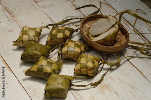 Ketupat is a typical Javanese dish made from rice which is wrapped in a wrapper made of woven young coconut leaves. Kupat, tupat, topat, tipat.  photo