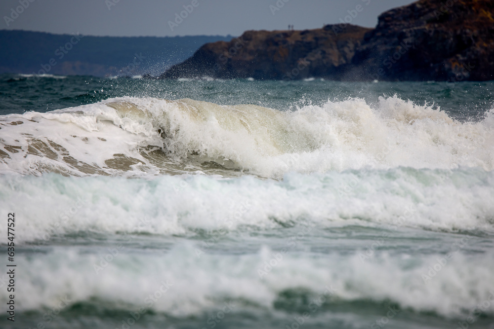 Abstract landscape with sea waves at the shore on a windy day.