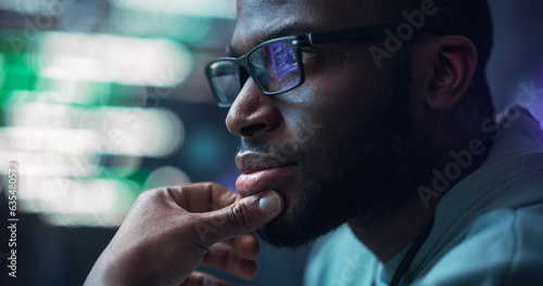 Fotografie Close Up Portrait of Male Programmer Developing New Software, Coding, Managing Cybersecurity Project