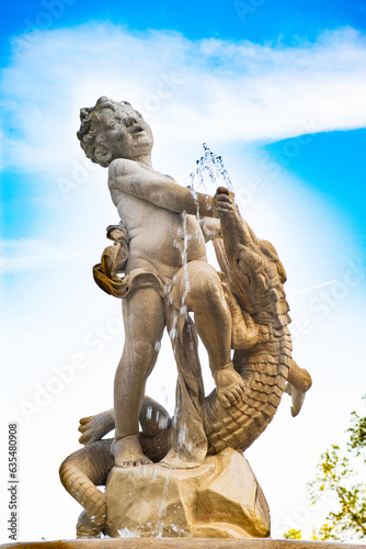 Fountain in the form of a sculpture of a boy and a crocodile in Vienna in Austria.