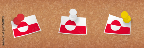 Greenland flag pinned in cork board, three versions of Greenland flag.
