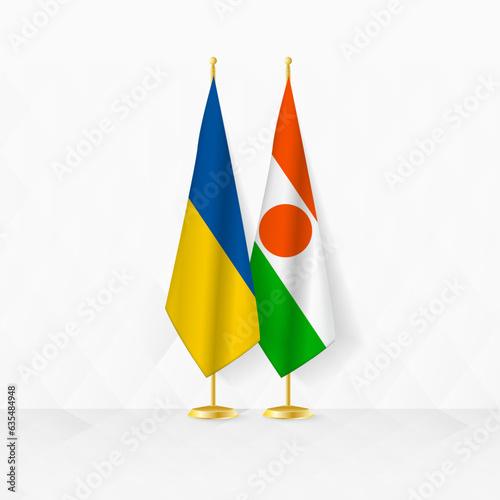 Ukraine and Niger flags on flag stand, illustration for diplomacy and other meeting between Ukraine and Niger.