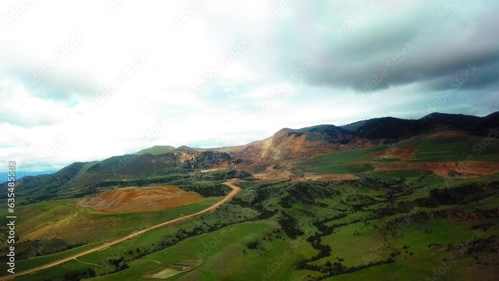 Aerial Shot Of Green Plants And Trees Against Cloudy Sky, Drone Flying Forward Over Natural Landscape - Billings, Montana Aerial Shot Of Green Plants And Trees Against Cloudy Sky, Drone Flying Forward Over Natural Landscape - Billings, Montana