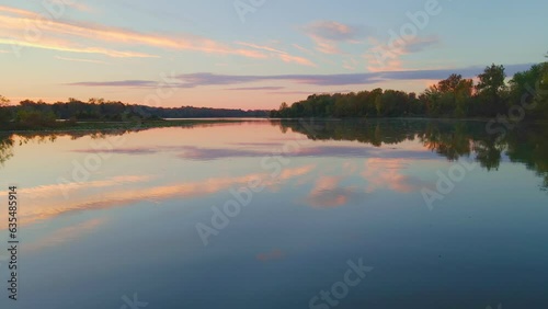 Autumn still lake in the mountains of Arkansas with mirrored water reflection shot vial drone aerial with colorful fall trees  photo