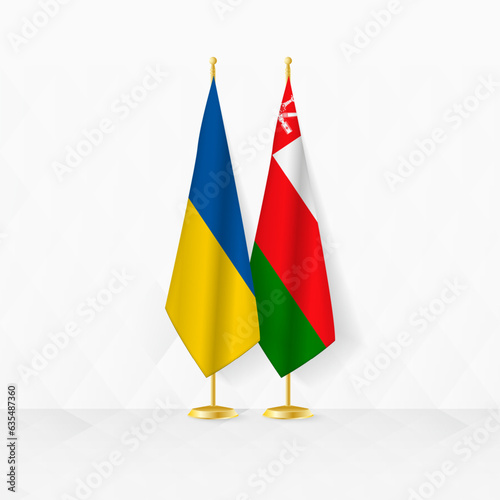 Ukraine and Oman flags on flag stand, illustration for diplomacy and other meeting between Ukraine and Oman.