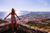 Young tourist woman and sea landscape with Terracina, Lazio, Italy. Scenic resort town village with nice sand beach and clear blue water. Famous tourist destination in Riviera de Ulisse