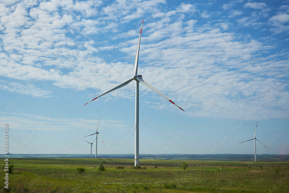 Wind power plant, clean energy. Wind turbines in the field.