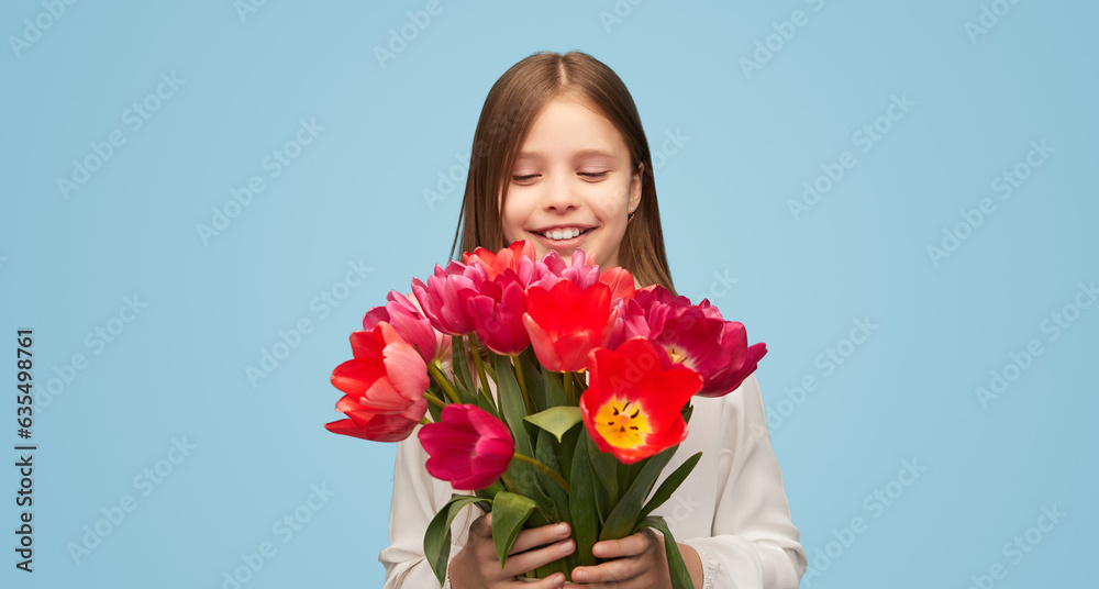 Little girl with colorful tulips on blue background Little girl with colorful tulips on blue background