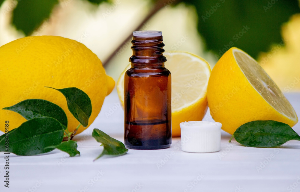 lemon oil in jars, fresh lemon. Selective focus. lemon oil in jars, fresh lemon. Selective focus.