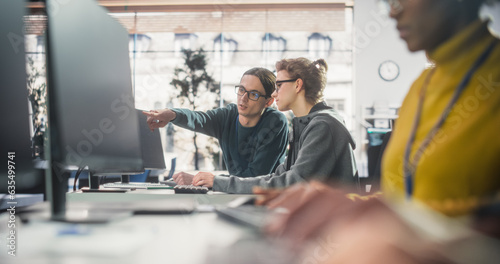 Smart Young Students Studying in University with Diverse Multiethnic Classmates. Happy Scholars Collaborate on a Software Project. Applying Knowledge to Acquire Academic Skills in Class