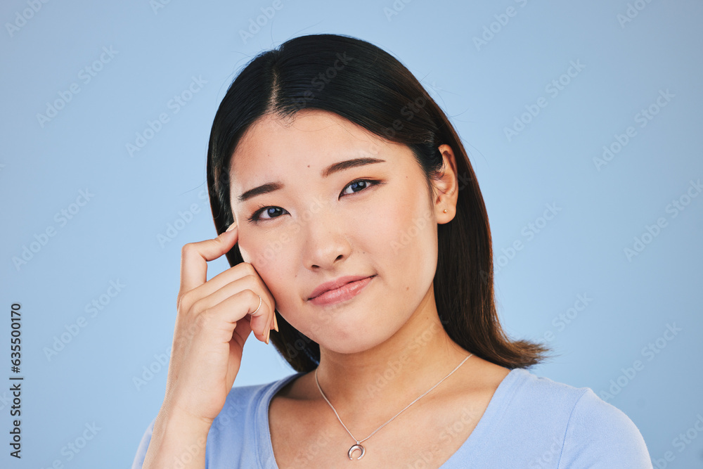 Portrait, thinking and Asian woman with ideas, solution and problem solving on a blue studio background. Face, Japanese person and model with a question, emoji and mockup space with brainstorming Portrait, thinking and Asian woman with ideas, solution and problem solving on a blue studio background. Face, Japanese person and model with a question, emoji and mockup space with brainstorming